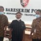 Agus dan Purwanto saat melapor ke Bareskrim Mabes Polri didampingi kuasa hukumnya