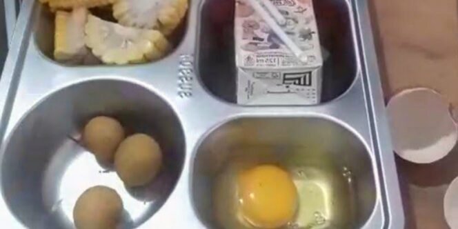 
					MBG di SMAN 1 Cigemblong Disorot, Telur dan Jagung Masih Mentah. (Foto.Ist)